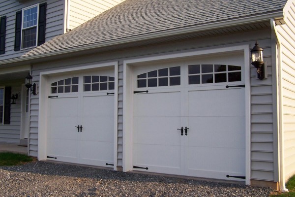 Image of a garage door installation on a white home.